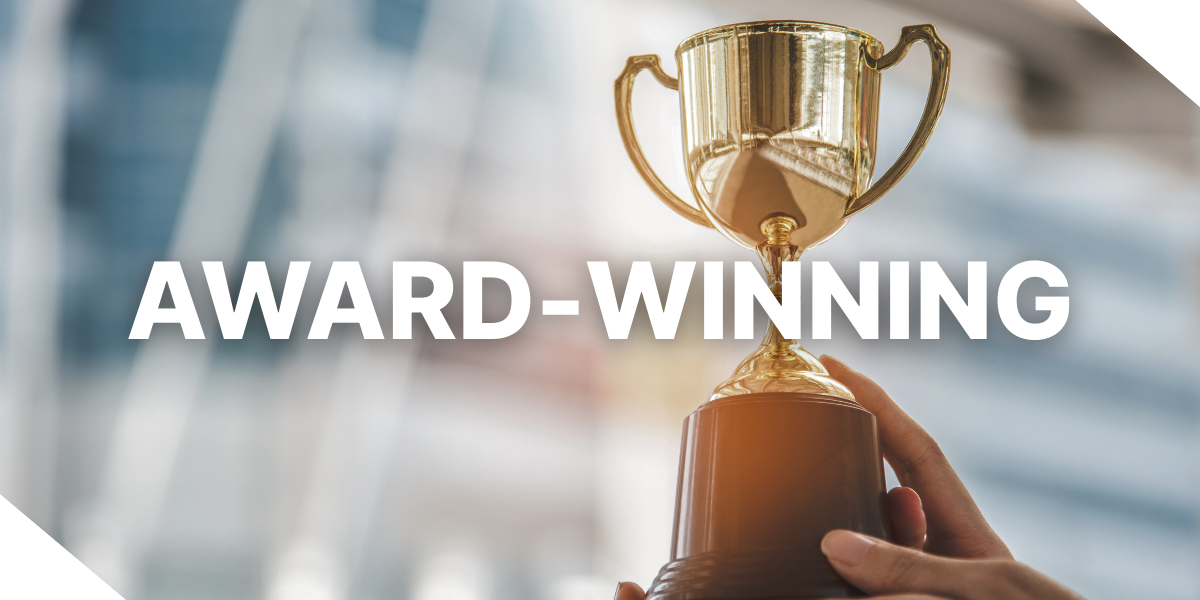 An image of two people holding a trophy with the text, ‘Award-winning’ overlaid, representing the multiple fintech awards Kiavi won in 2025.