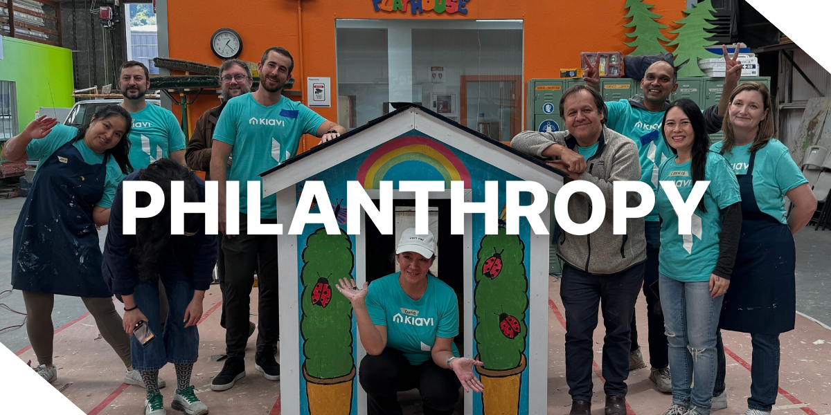 An image of several Kiavi employees participating in a Habitat for Humanity Playhouse build in San Francisco, CA in 2025. The word ‘Philanthropy’ is displayed across the image.
