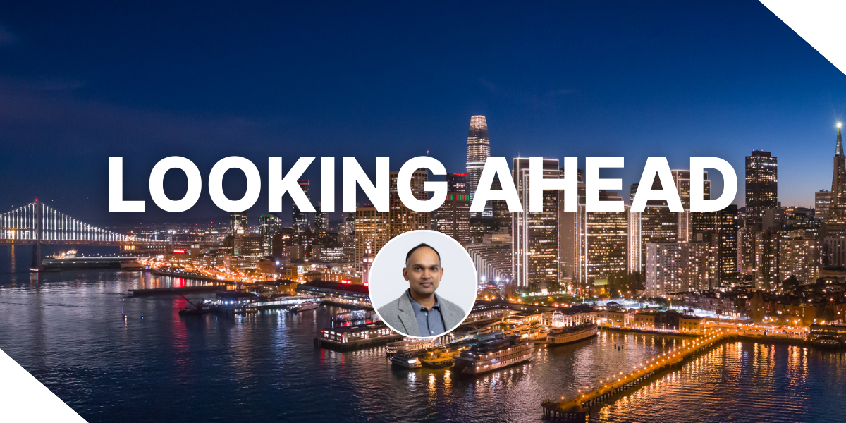 An image of Arvind Mohan, CEO of Kiavi, with the text ‘Looking Ahead’ overlaid. The background is an image of San Francisco, where one of Kiavi's offices is located.