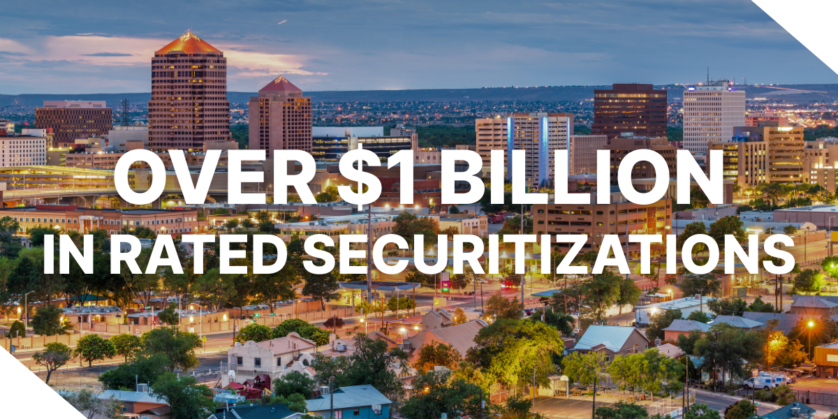 A picture showcasing real estate in Albuquerque, New Mexico, which is one of the 17 new states Kiavi began supporting in 2025. The text "OVER $1 BILLION IN RATED SECURITIZATIONS" is overlaid on the image.