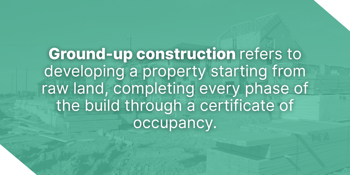 A residential construction site showing houses in various stages of framing with an overlay defining ground-up construction.