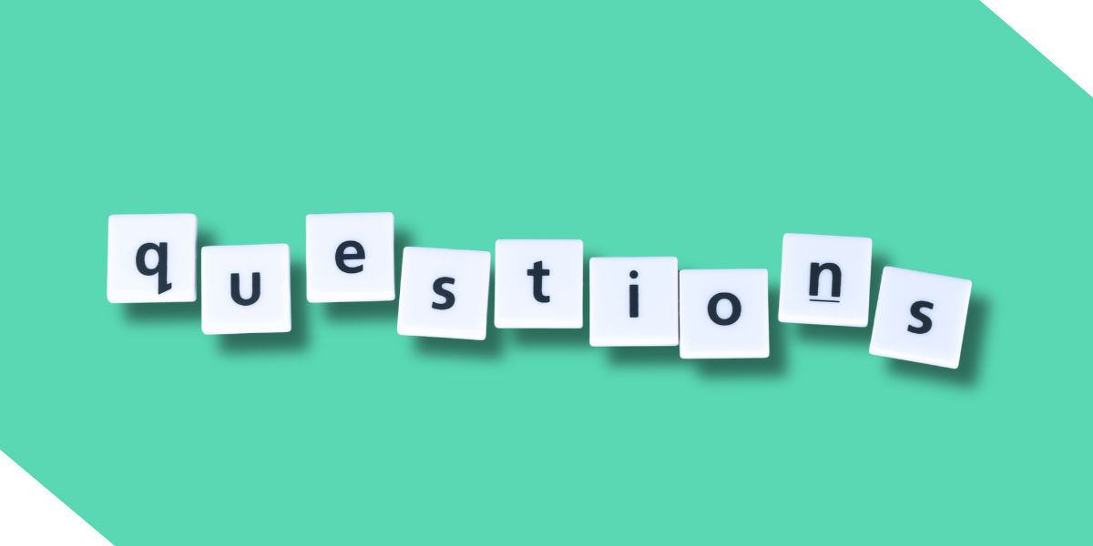 Scrabble tiles spelling out "questions" on a teal background, representing frequently asked questions (FAQ) for real estate investors and contractors.