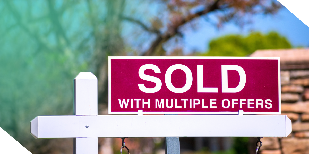 A ‘SOLD with multiple offers’ sign in front of a newly flipped real estate investment property. 