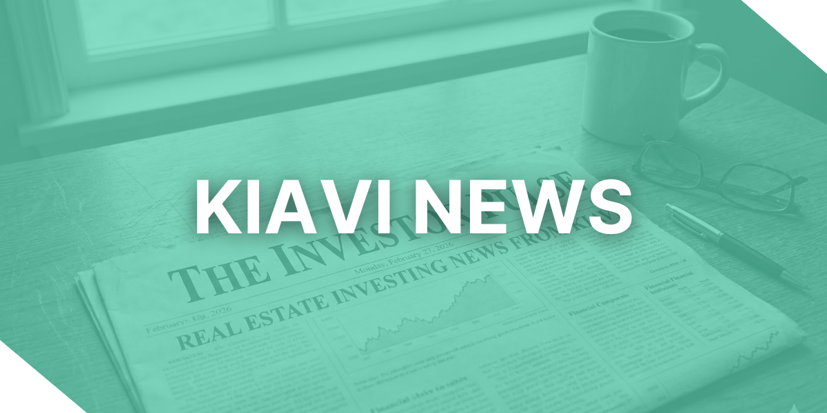 A newspaper with fix-and-flip market data and Kiavi updates on a desk with glasses and a pen.