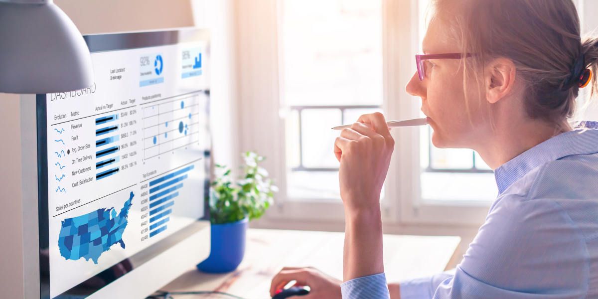 female real estate investor doing market research on a computer