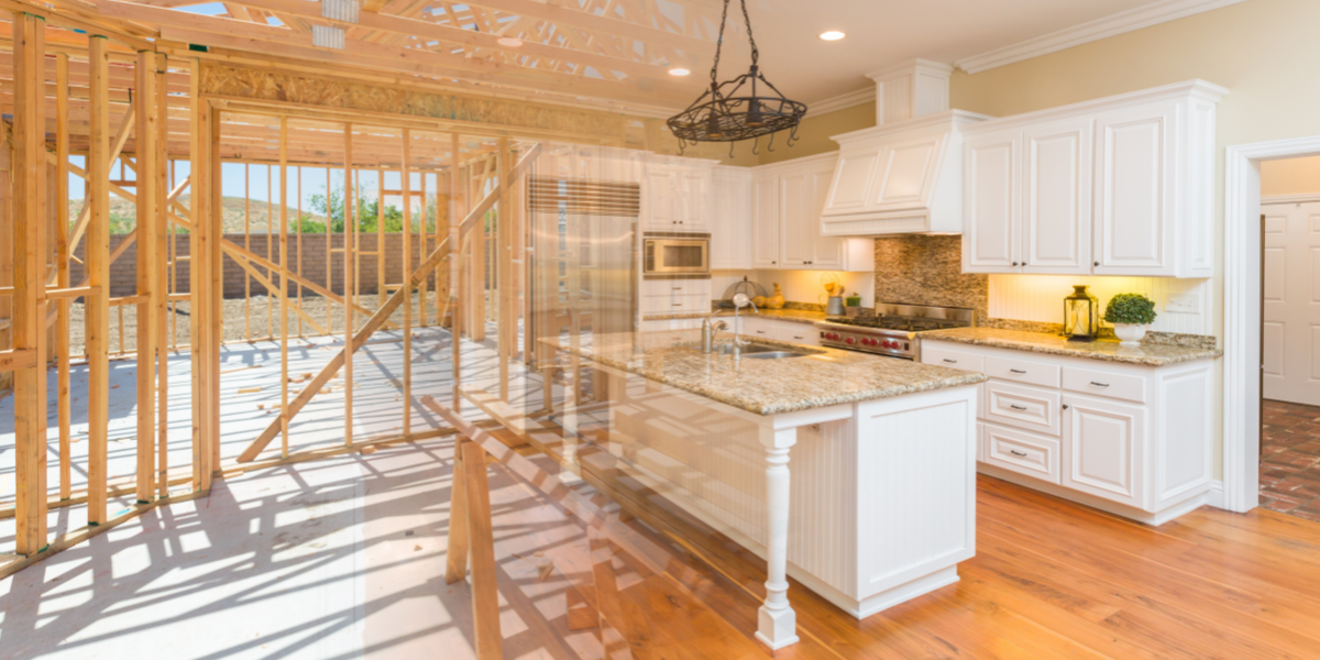 A partially constructed kitchen with wood framing, featuring white cabinets and a granite countertop. This is perfect for a fix-and-flip project with a modern, upgraded design that could boost ROI.