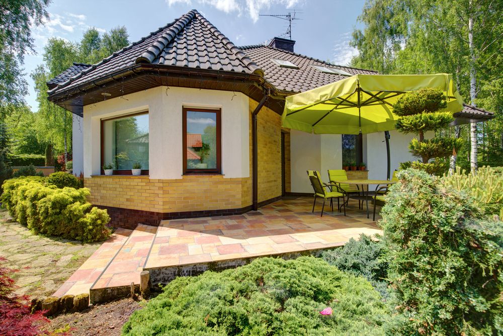 Exterior of fixer upper house with terrace 