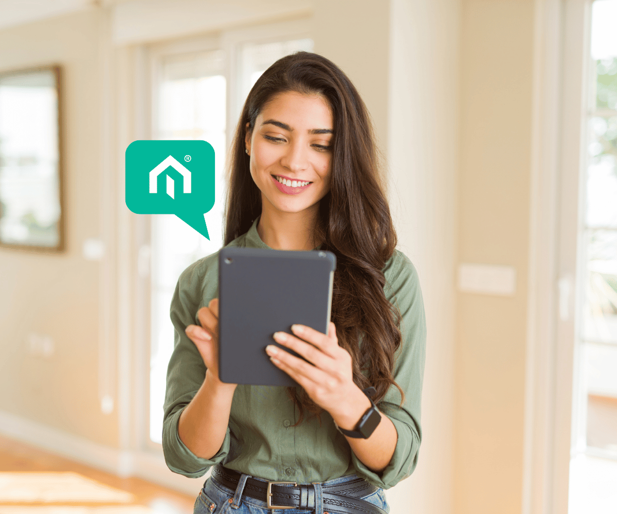 Smiling woman using the Kiavi AI-powered platform on a tablet for rental property financing.