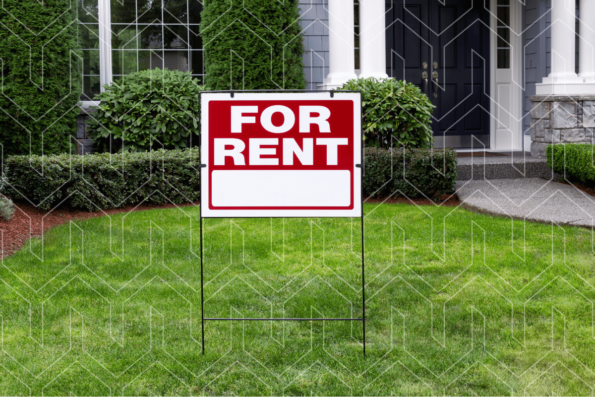 For rent sign on the lawn of a rental property secured with Kiavi real estate investment financing.