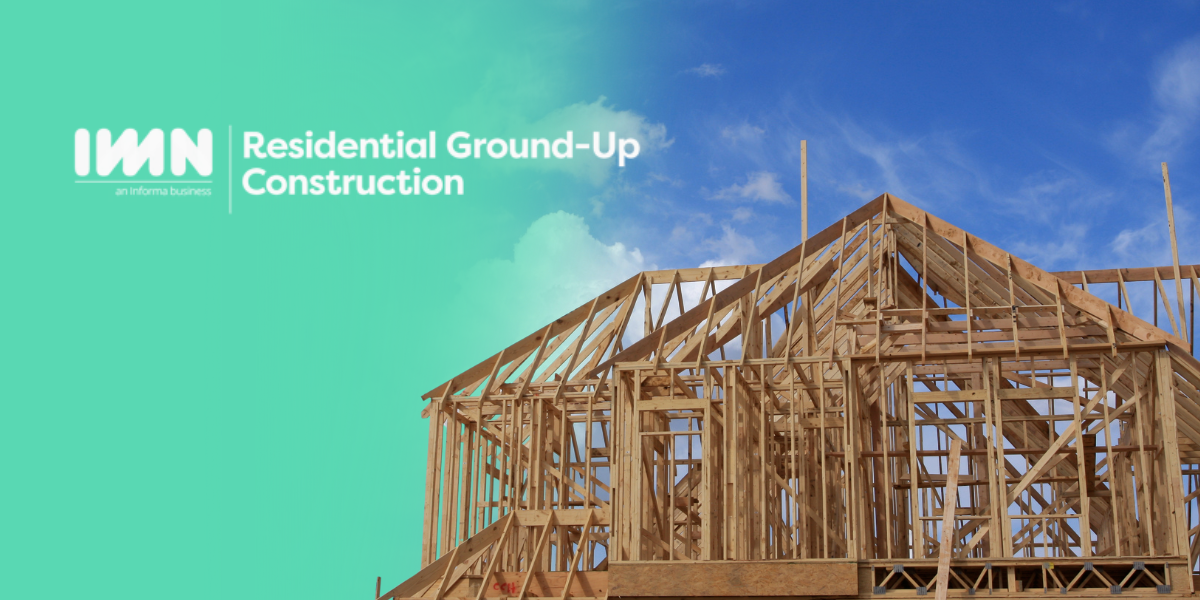 Wooden framework of a house under construction against a blue sky, with the IMN Residential Ground-Up Construction logo.