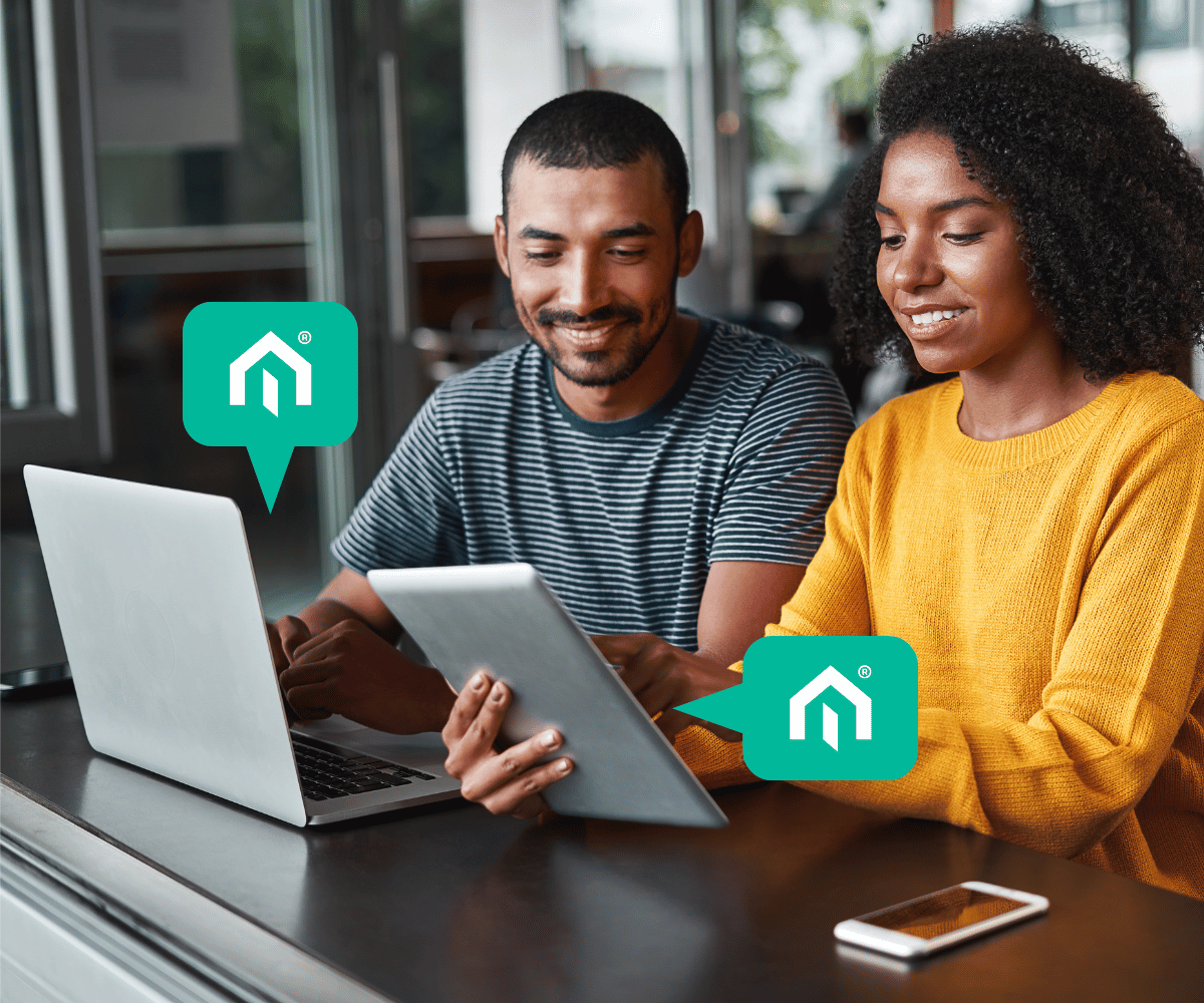 Two real estate investors on devices using the Kiavi affiliate network to connect real estate investors with financing.