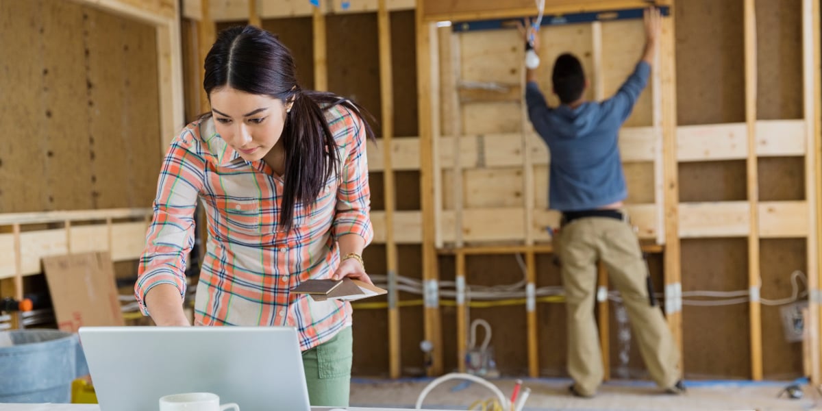 a real estate investor couple working on a property renovation