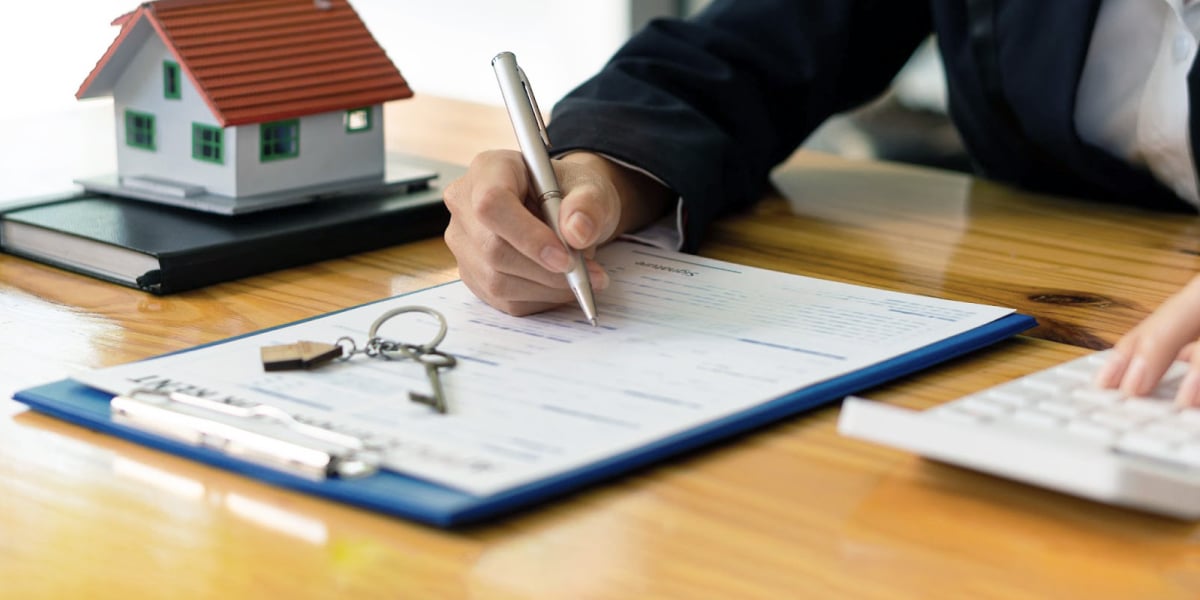 rental real estate investor signing documents