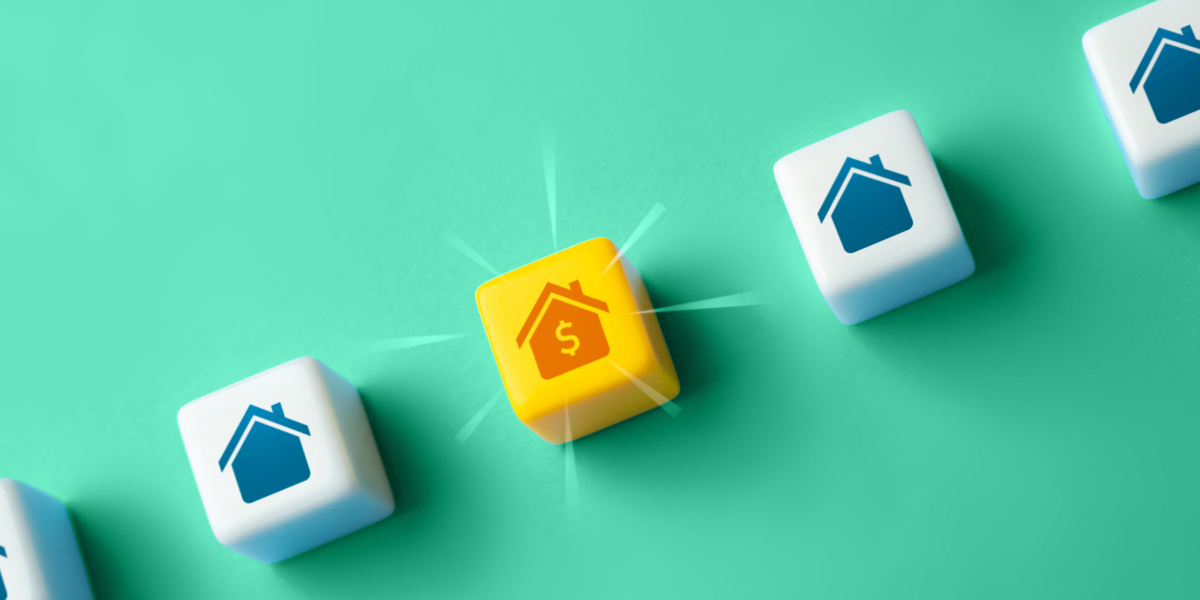 Iconic representation of real estate growth with a highlighted cube displaying a house and dollar sign, symbolizing financial opportunities in property investment.