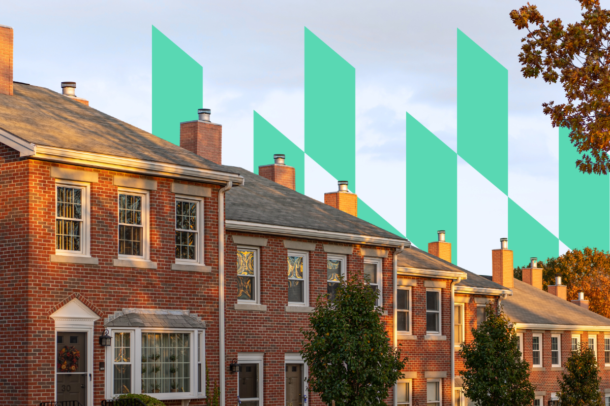 Row of brick homes in Massachusetts with trees in the front and green geometric shapes in the background.