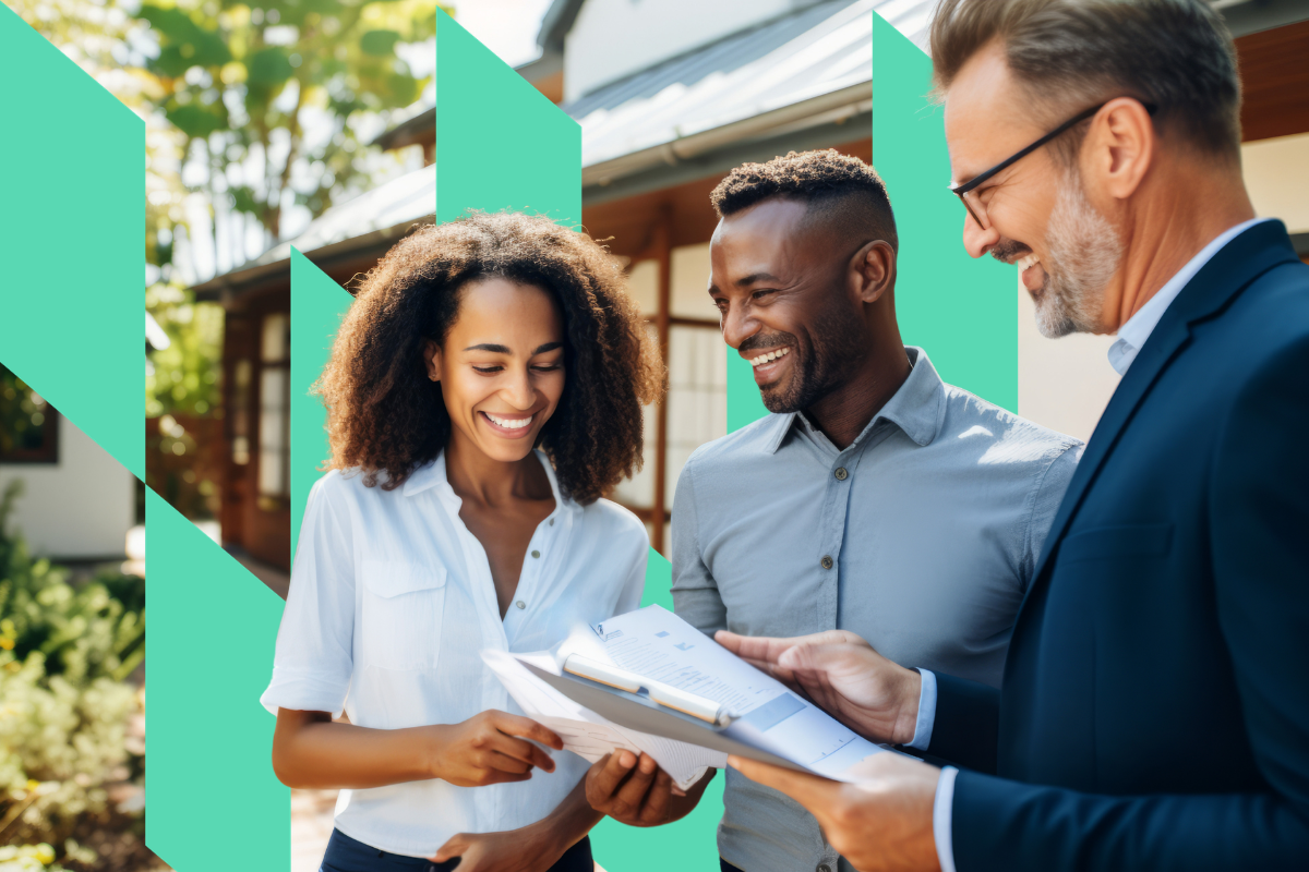 Three real estate agents smile while looking over Kiavi paperwork in front of a house for sale.