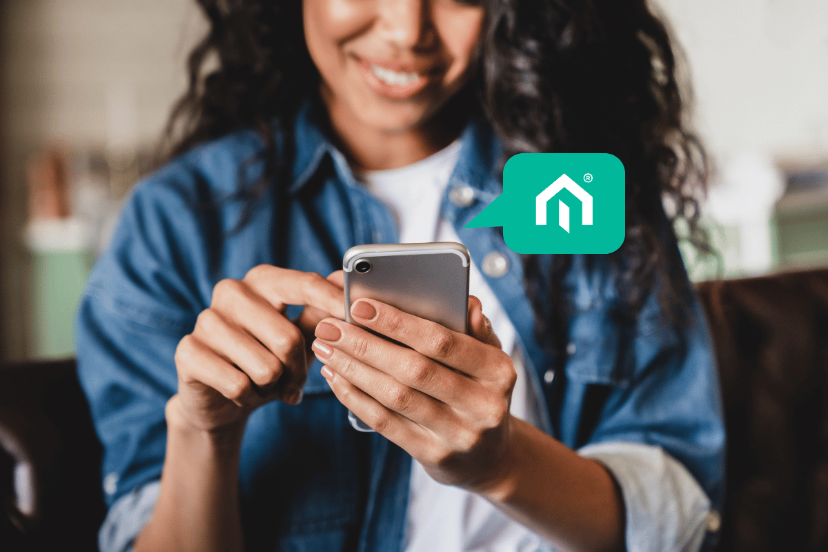 A female real estate investor using the Kiavi AI-powered platform on mobile to review DSCR loan financing options.