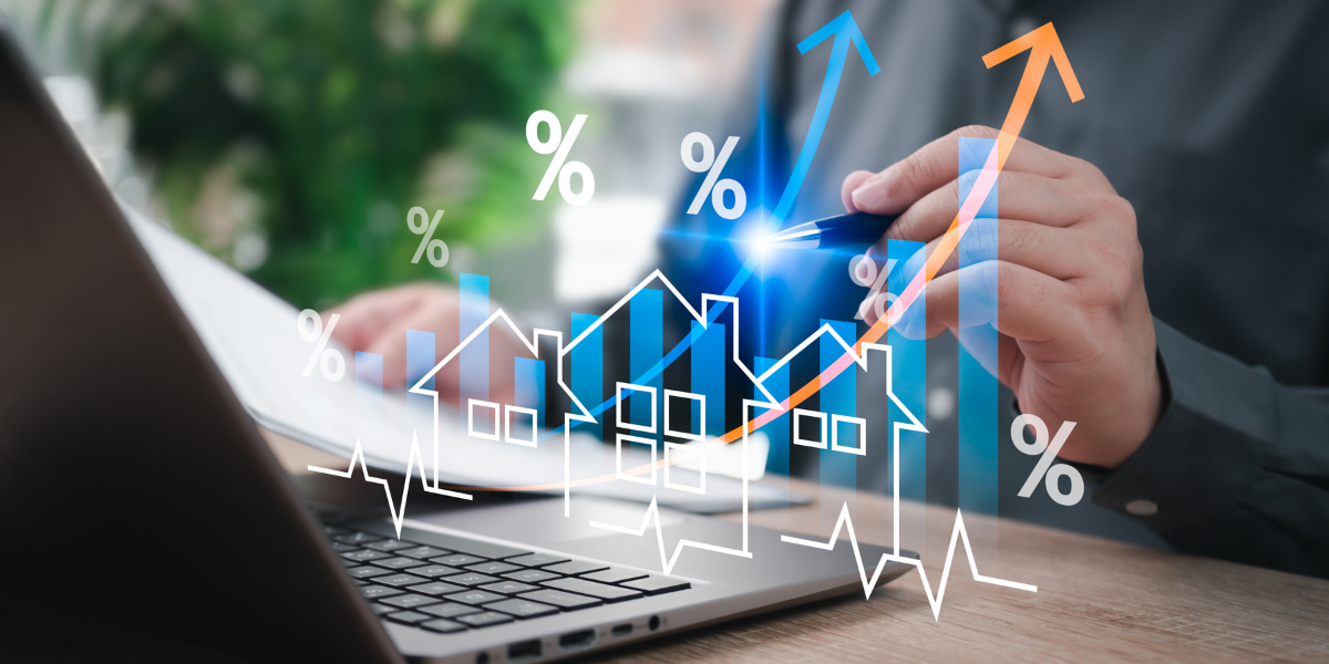 Image Alt: Conceptual image of real estate market analysis showing fluctuating mortgage rates, housing trends, and financial data on a computer.